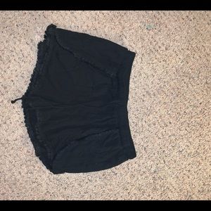 Black ruffled cotton shorts